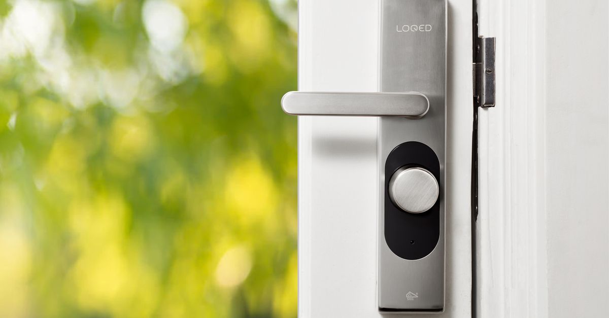 locksmith hands door — Livingston Locksmith Inc