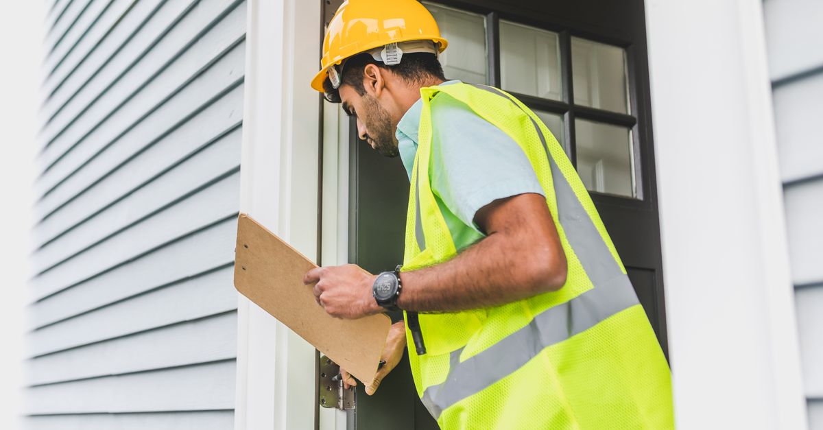 locksmith hands door — Livingston Locksmith Inc